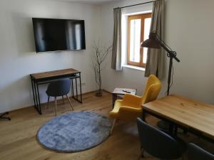 TV a/nebo společenská místnost v ubytování Quartier No. 7 - Serviced Living