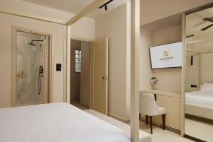 A bed or beds in a room at Sofia Resort Luxury Suites
