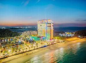 a tall building on the beach at night at Saturday HOME - 7th floor of Hải Tiến in Thanh Hóa