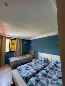 Katil atau katil-katil dalam bilik di Villa de Luxe avec Vue sur Mer, Grand Jardin et Piscine Privée à Tabarka