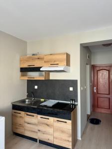 a kitchen with a sink and a counter top at Студио Мая in Sunny Beach