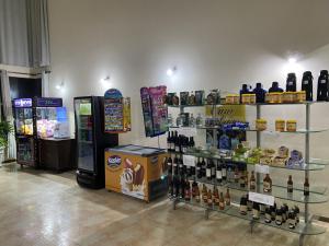 a store with a lot of bottles of alcohol on display at Hotel Valle Sul in Registro