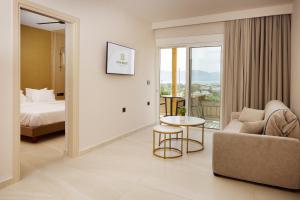 A bed or beds in a room at Sofia Resort Luxury Suites
