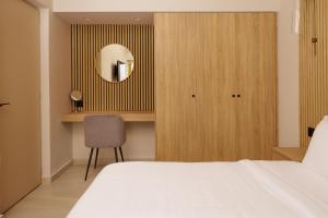 A bed or beds in a room at Sofia Resort Luxury Suites