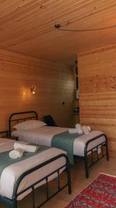 Кровать или кровати в номере Garden rooms in Kutaisi