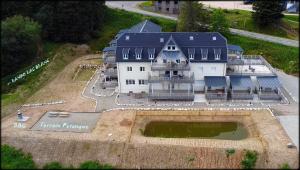 an aerial view of a large white house at Sur la rive du Lac in Orbey