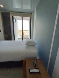 Postel nebo postele na pokoji v ubytování RB Hotel