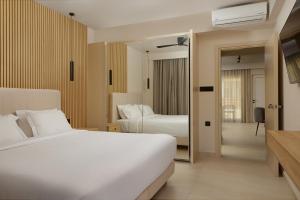 A bed or beds in a room at Sofia Resort Luxury Suites