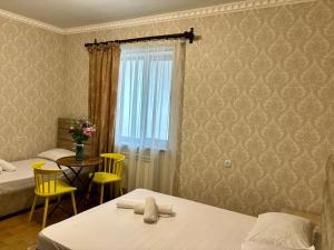 Postel nebo postele na pokoji v ubytování Styopa Hotel