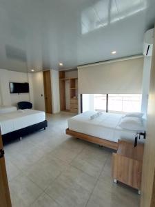 Postel nebo postele na pokoji v ubytování RB Hotel