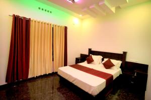 a bedroom with a bed and a red curtain at Hillsidecreek Homestay in Anachal +30 photos