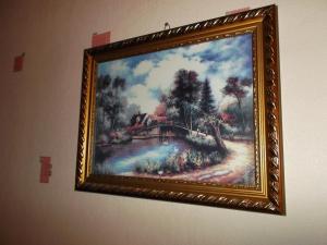 a picture of a painting hanging on a wall at Airport Apartment in Tallinn