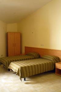 Säng eller sängar i ett rum på Hostels Euro Mediterraneo