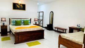 Letto o letti in una camera di Sigiri Prabha Villa