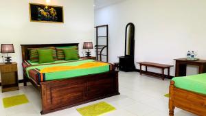 Letto o letti in una camera di Sigiri Prabha Villa