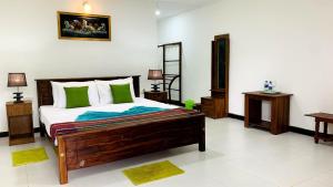 Letto o letti in una camera di Sigiri Prabha Villa