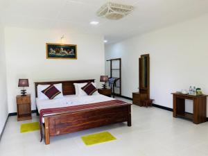 Letto o letti in una camera di Sigiri Prabha Villa