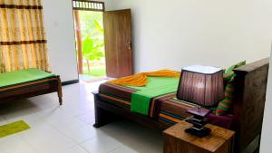 Letto o letti in una camera di Sigiri Prabha Villa