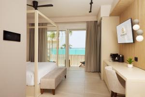 A television and/or entertainment centre at Sofia Resort Luxury Suites