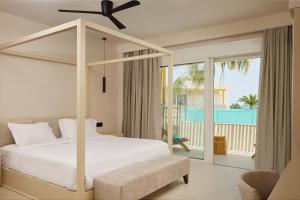 A bed or beds in a room at Sofia Resort Luxury Suites