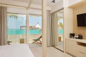 A bed or beds in a room at Sofia Resort Luxury Suites