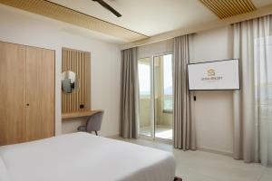A bed or beds in a room at Sofia Resort Luxury Suites