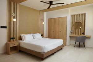 A bed or beds in a room at Sofia Resort Luxury Suites