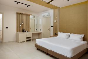 A bed or beds in a room at Sofia Resort Luxury Suites
