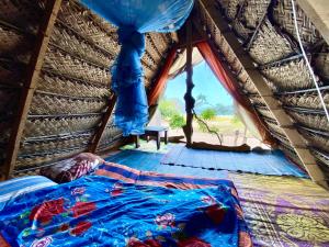 Postel nebo postele na pokoji v ubytování Nilana beach cabana