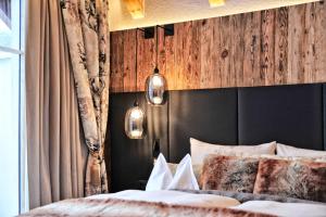 Postel nebo postele na pokoji v ubytování Salnerhof Superior Lifestyle Resort