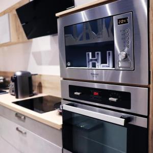 a microwave oven sitting on top of a kitchen counter at Cocon Etoilé SPA PRIVATIF ET CIEL ÉTOILÉ in Le Havre