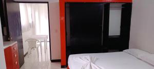 Postel nebo postele na pokoji v ubytování Hospedaje Carmelita Tocaima