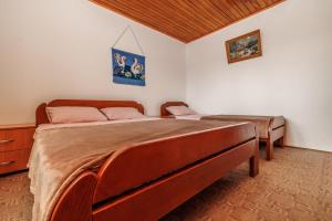 Postel nebo postele na pokoji v ubytování Guest House Highland
