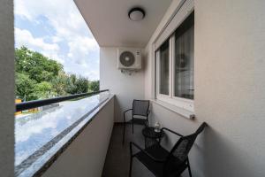 Balkón nebo terasa v ubytování NinaS Apartman