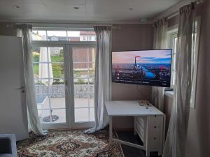 TV a/nebo společenská místnost v ubytování Highly recommended Apartment Trymsvei