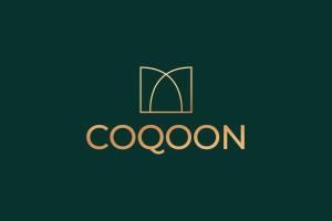 un logo pour une librairie avec un livre dans l'établissement Charlotte House Residence by COQOON, à Manchester