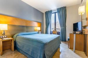 เตียงในห้องที่ Hotel del Mar