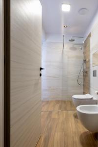 a bathroom with a toilet and a sink at L&C Beach Home by Zora apartament,pe plaja in Mamaia Nord +42 photos