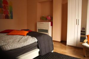 a bedroom with a bed and an oven in it at Freizeithof Hildesheimer Börde in Holle