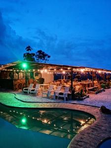 a resort with a swimming pool at night at Cabaña la fundadora in San Luis