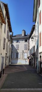 an empty street in an alley between two buildings at STUDIO Centre Ville in Aurillac