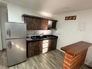 Η κουζίνα ή μικρή κουζίνα στο Apartamento cerca a charco corazón