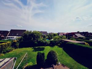 a view of a yard with trees and houses at 3 Zimmer Unterkunft in Bocholt