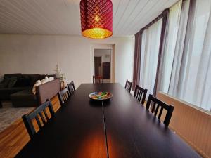 a dining room table with chairs and a plate of fruit on it at 3 Zimmer Unterkunft in Bocholt