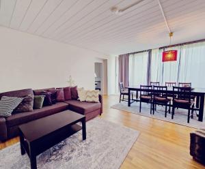 a living room with a couch and a dining room at Haus mit 6 Zimmer in Bocholt
