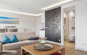 a living room with a couch and a table at Cloud in Binz
