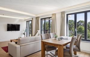 a living room with a table and a couch at Cloud in Binz