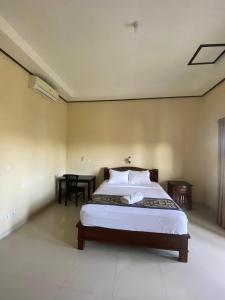 Ένα ή περισσότερα κρεβάτια σε δωμάτιο στο Pucuk Bali Guest House Canggu