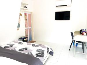 TV a/nebo společenská místnost v ubytování WIWI Village