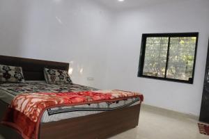 Uma cama ou camas num quarto em Gir Enjoy Forest Resort